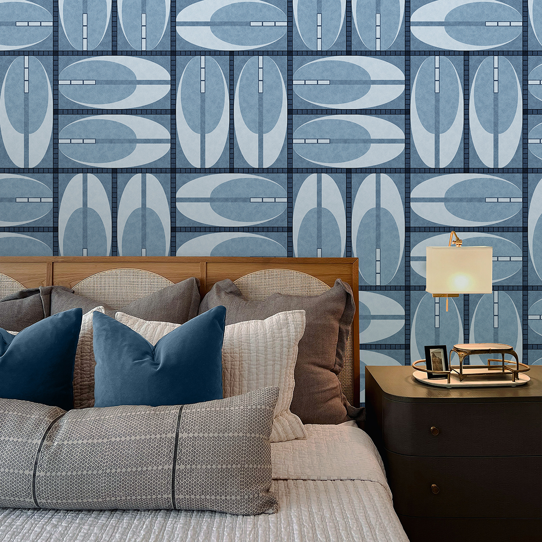 The artwork features a repeating geometric pattern of symmetrical shapes resembling elongated, curved diamonds or petals in various shades of blue and green. Each shape is split vertically with one half filled with a light blue and the other half filled with green or darker blue. The background is a light, almost pastel blue, which provides a soft yet vibrant backdrop. One of the blue shapes near the upper left contains a white starburst element, adding a focal point of brightness to the composition. The overall design conveys a modern, mid-century aesthetic with clean lines and harmonious color contrasts.